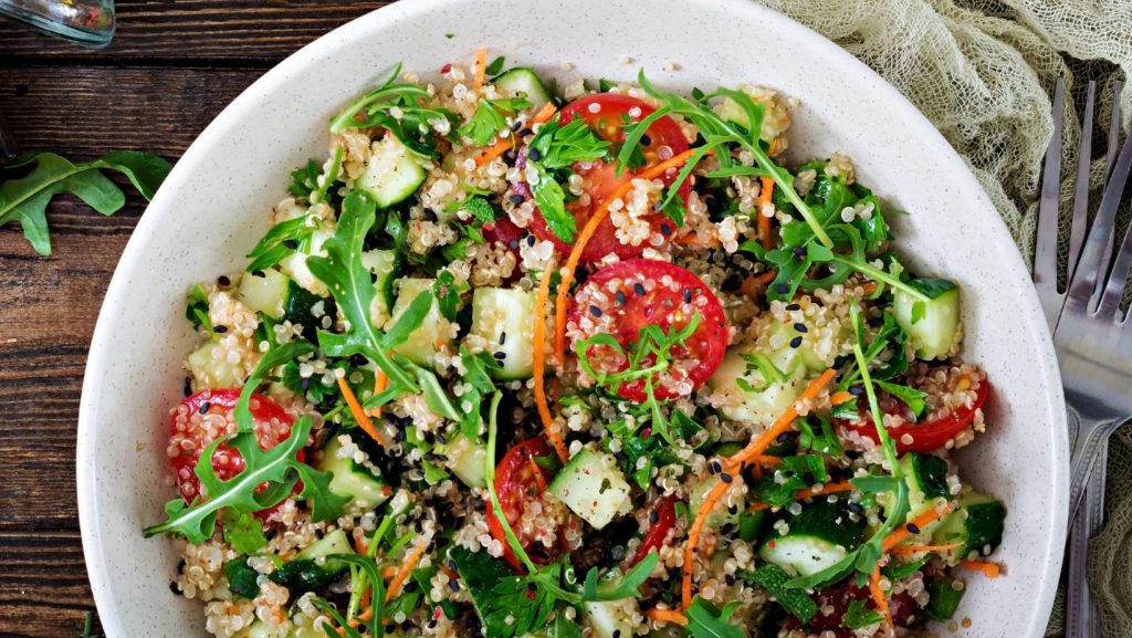 Fresh mixed salad with seasonal vegetables, herbs and seeds